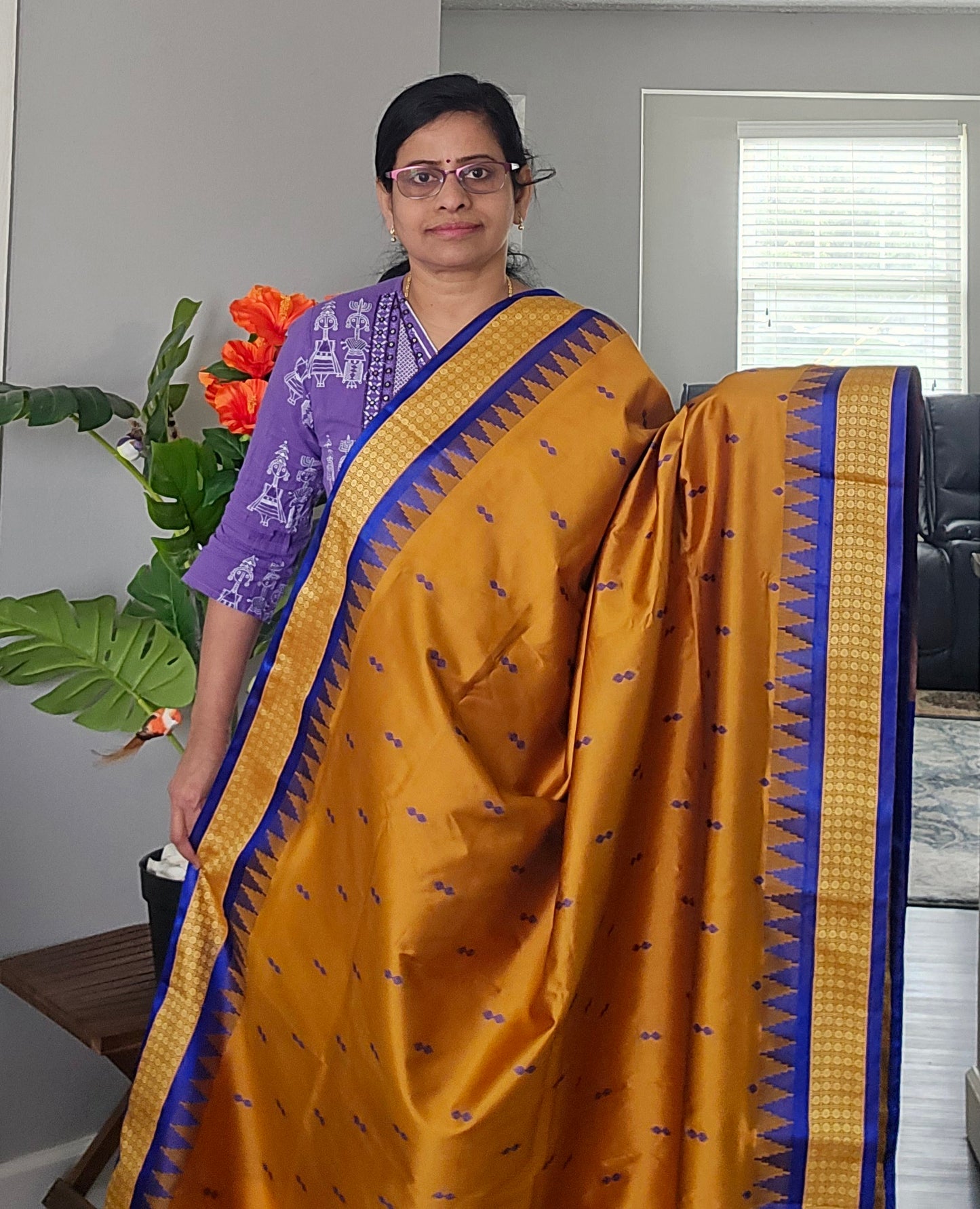 Mustard/turmeric yellow Sambalpuri Bomkai silk saree with royal blue stitched blouse. Code - SAR103