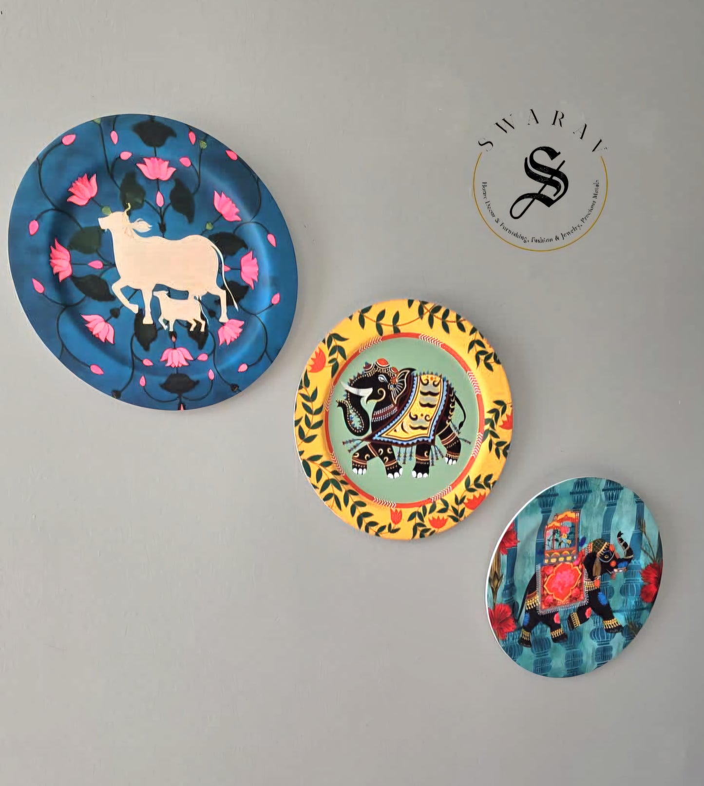 Set of 3 - Acrylic wall plates with cow and elephant print. size - 11 inch diameter.