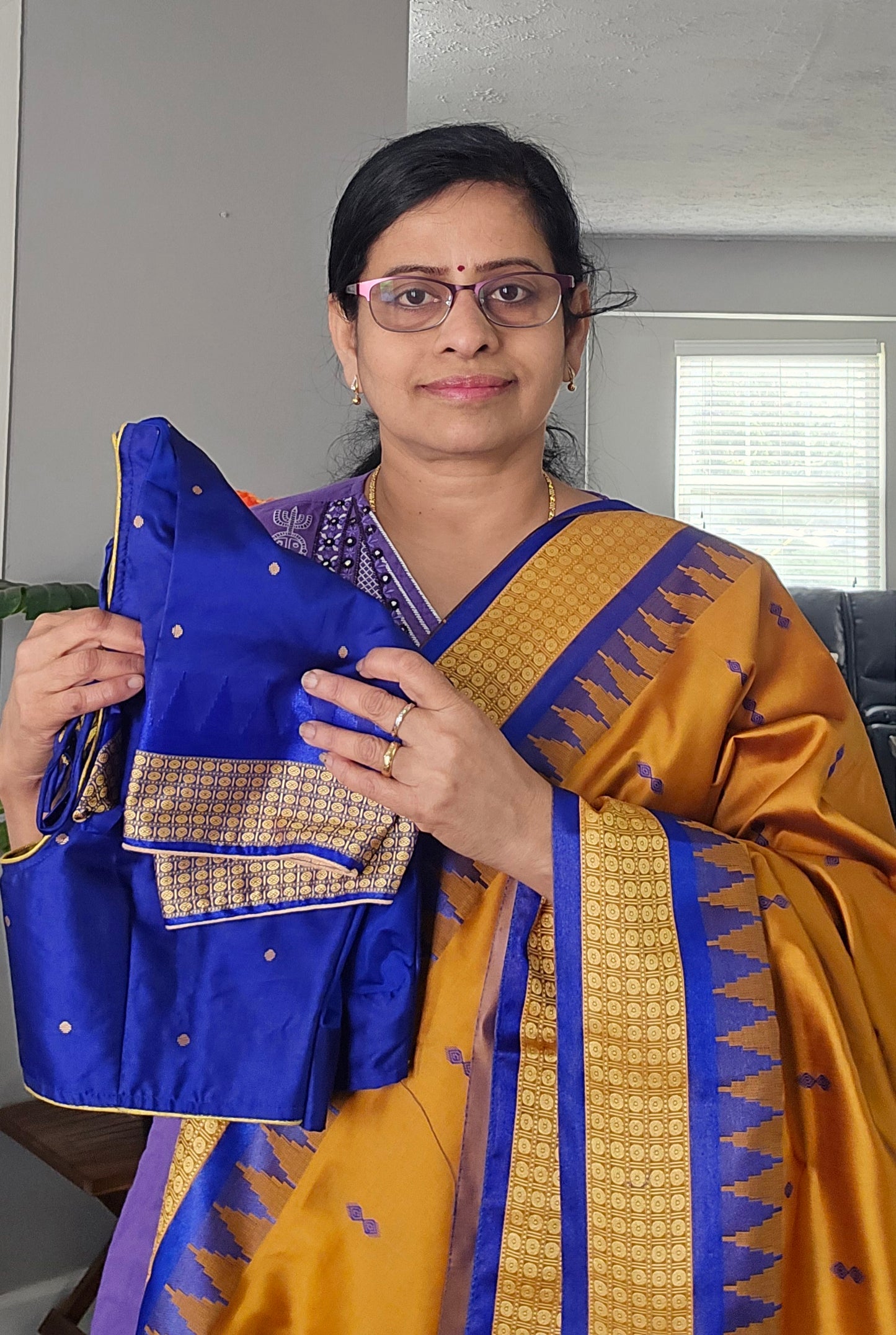Mustard/turmeric yellow Sambalpuri Bomkai silk saree with royal blue stitched blouse. Code - SAR103