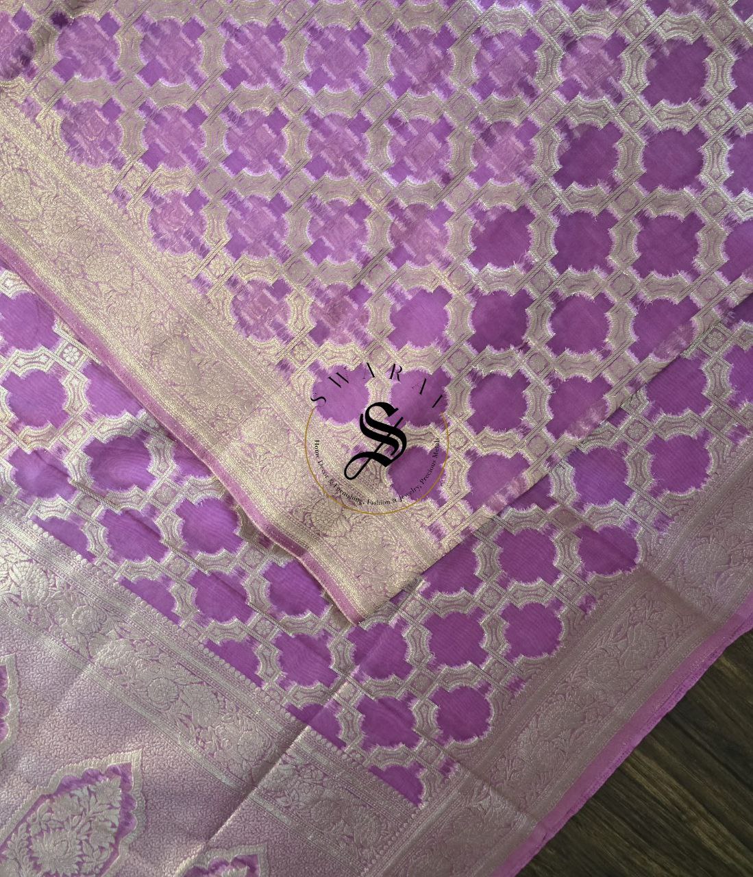 Organza Zari woven Majenta Banarasi Saree with plain running Blouse piece.