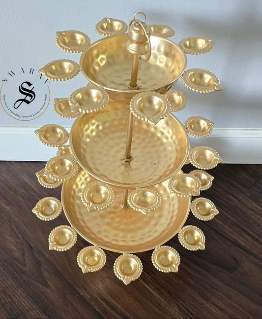 3 Tier Metal hand hammered Diya Urli in gold finish. 30 inch height.