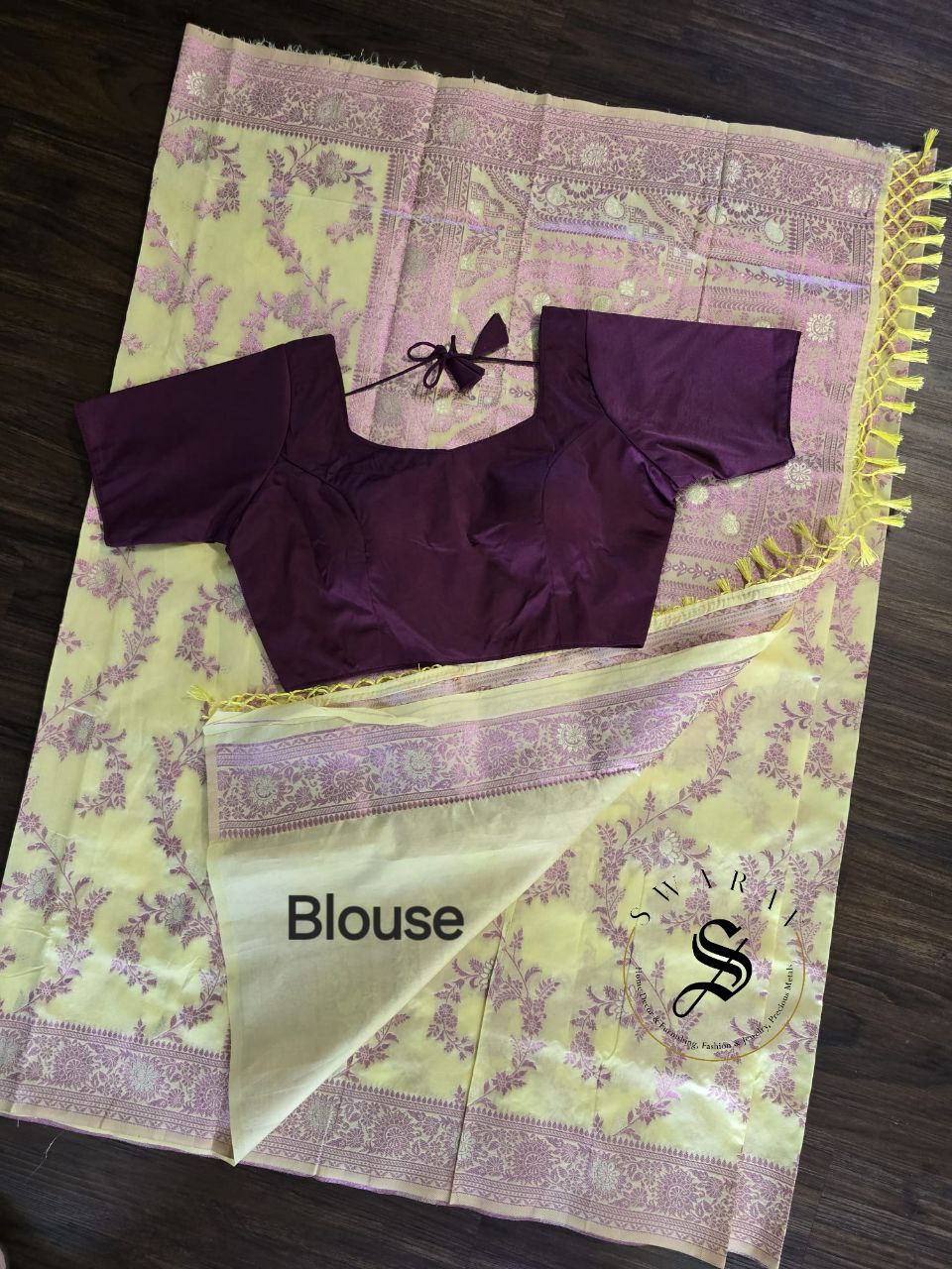 Organza Banarasi Saree with FREE ready to wear Blouse. Color - Pastel Yellow with shiny purple zari work all over.