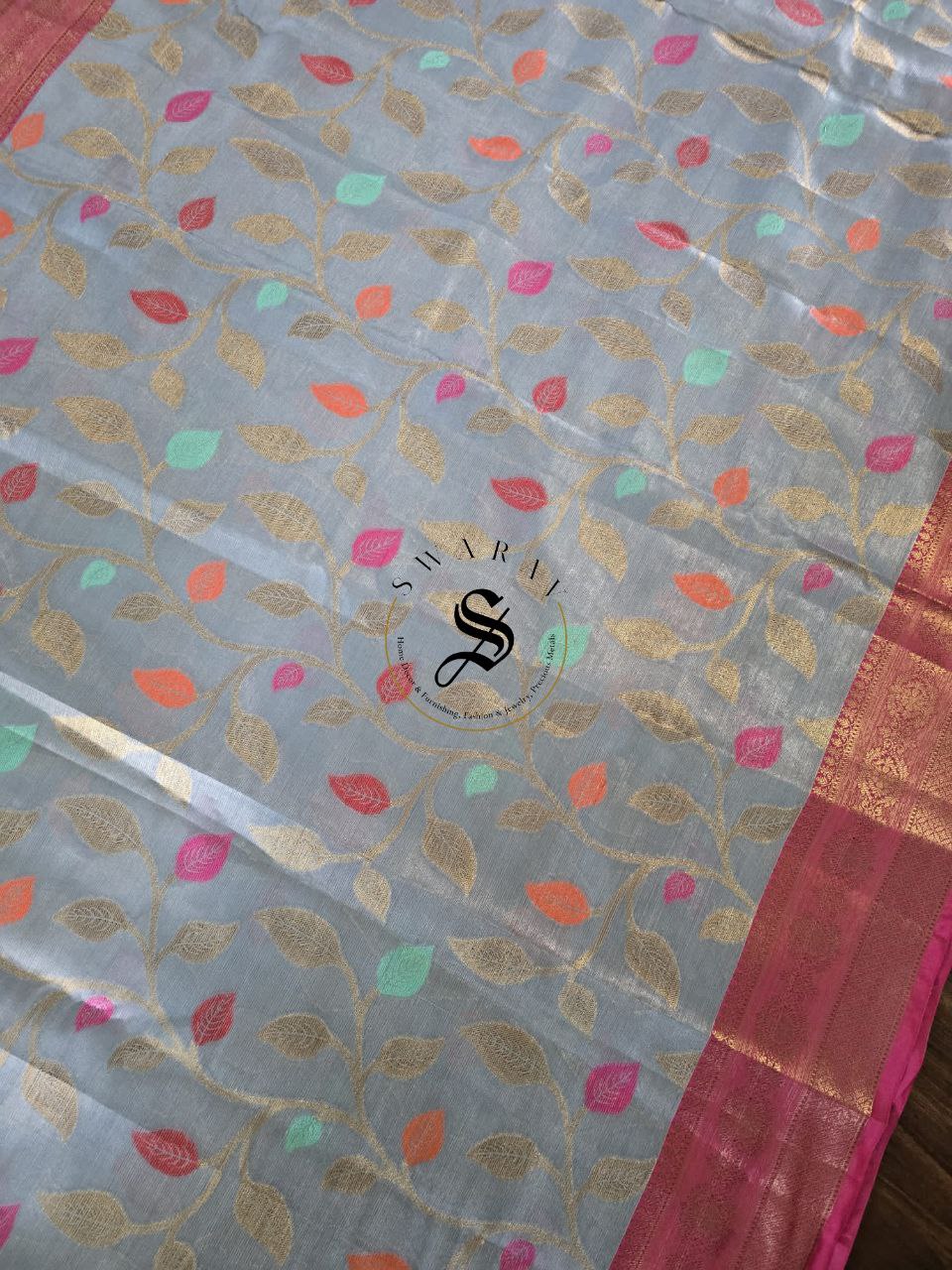 Tissue Silk saree with Zari weave leaf pattern with contrast Brocade blouse piece.