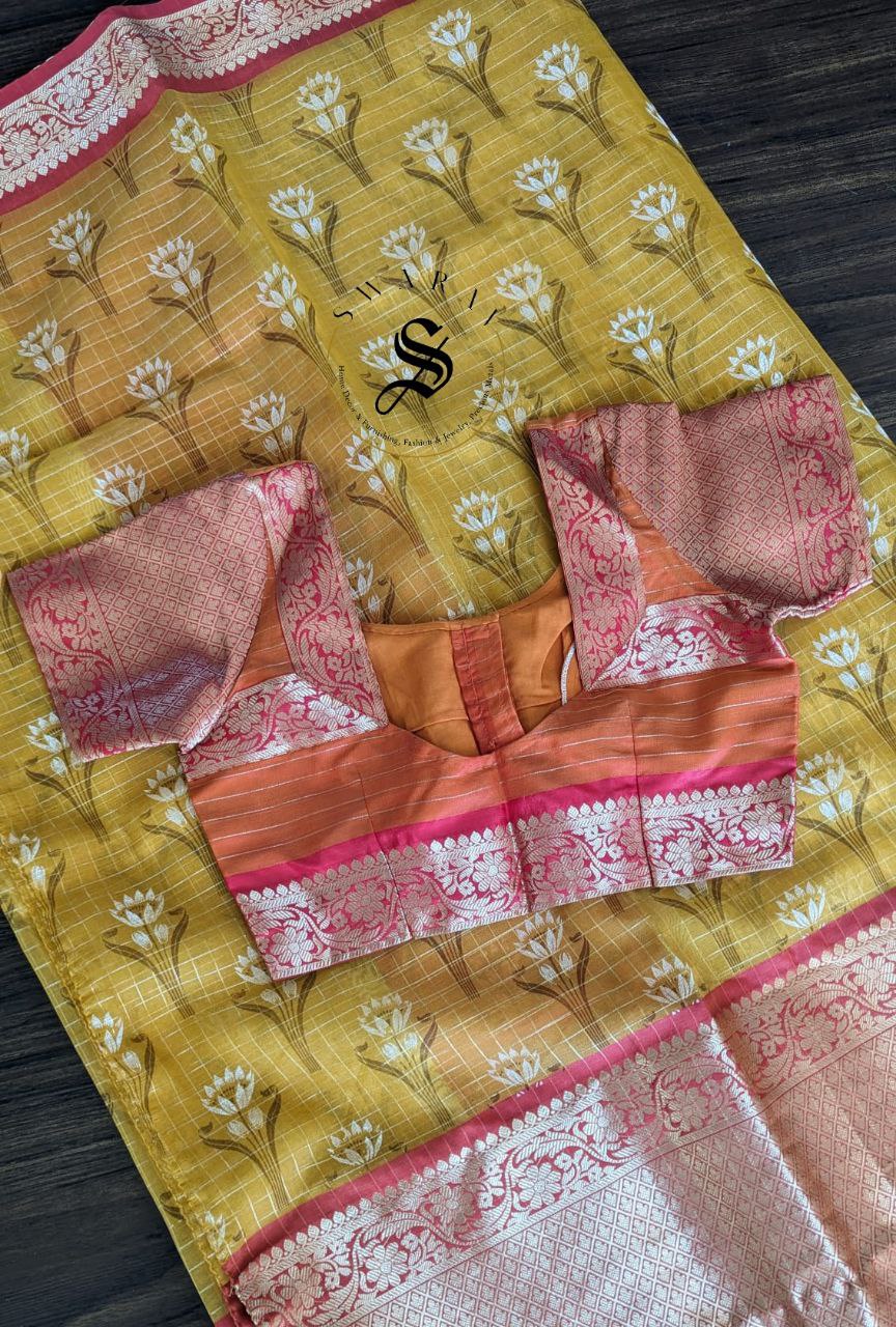 Organza floral silk saree with zari weave kanchi style skirt border and stitched blouse.