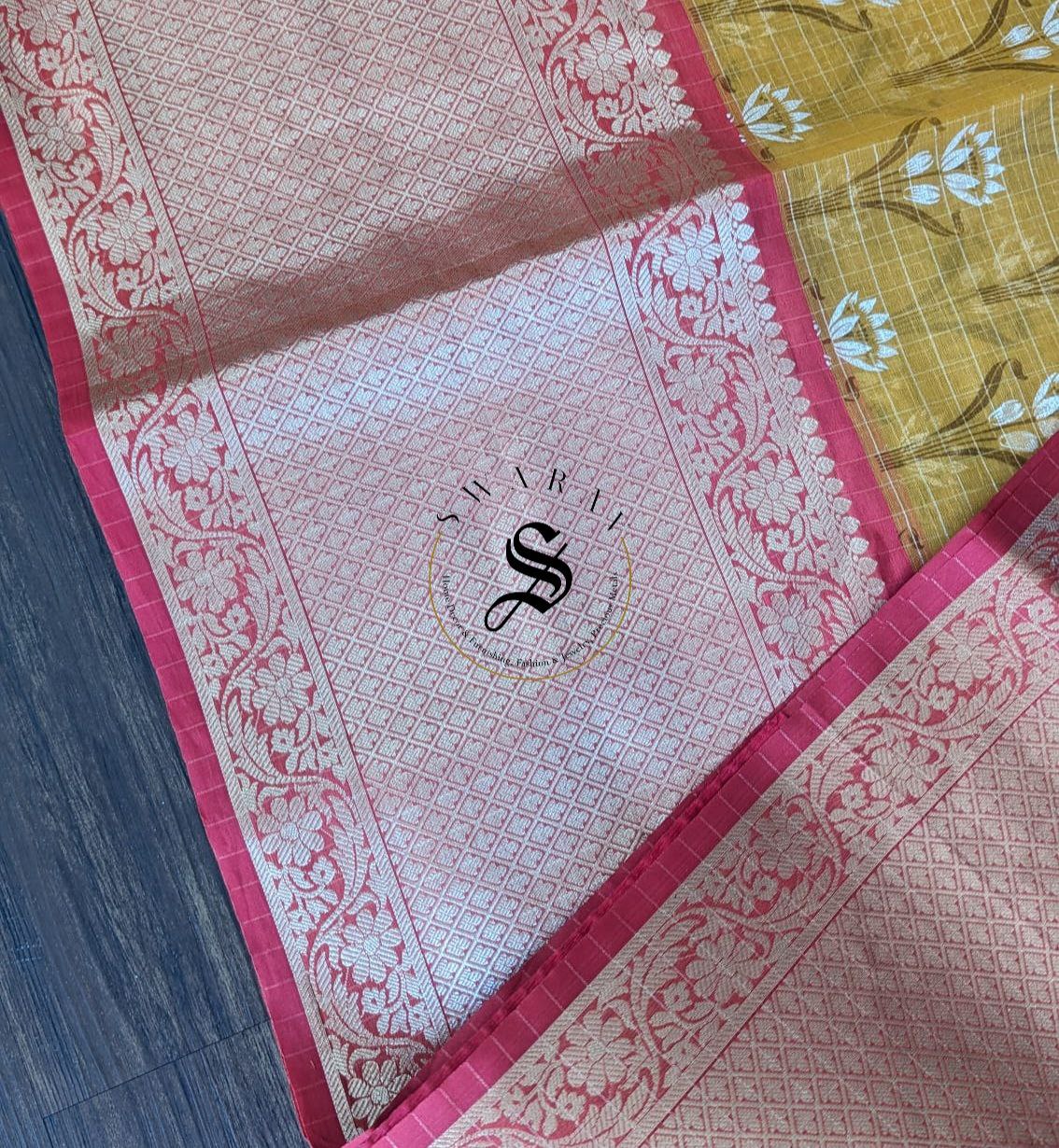 Organza floral silk saree with zari weave kanchi style skirt border and stitched blouse.
